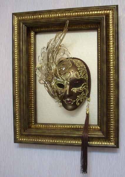 Framed mask on the wall