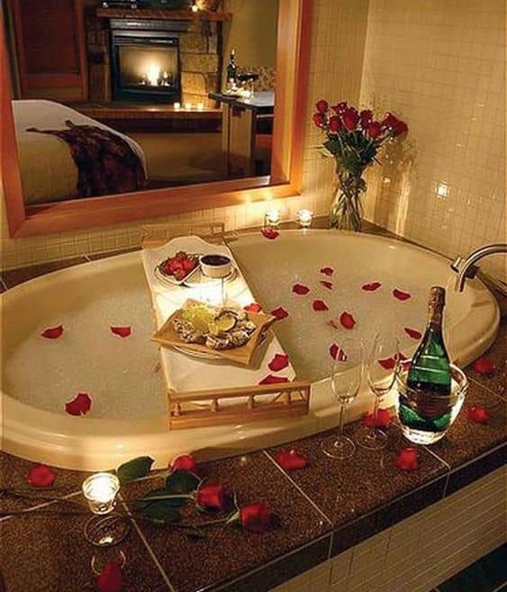 Passionate Floral Bathtub Decoration with roses candles lights and wine