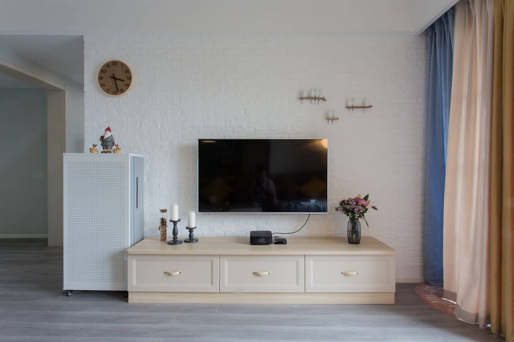 living room wall with tv on the wall decorated